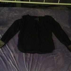 this shirt with gold ruffles